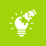 Puzzle piece completing lightbulb on green background.